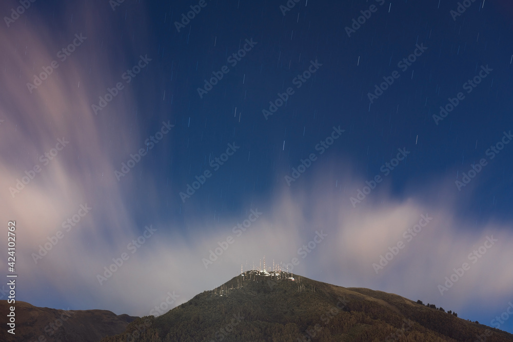 Long exposure of the Pichincha volcano with star trails at night, Quito, Ecuador.