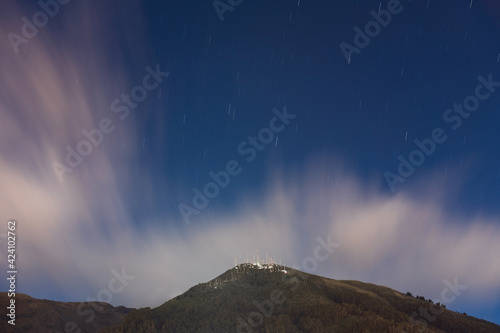 Long exposure of the Pichincha volcano with star trails at night, Quito, Ecuador.