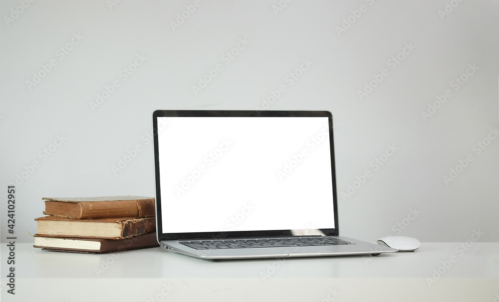 Fototapeta premium Modern workspace with computer with blank screen and equipment on white table.Blank screen for your information.