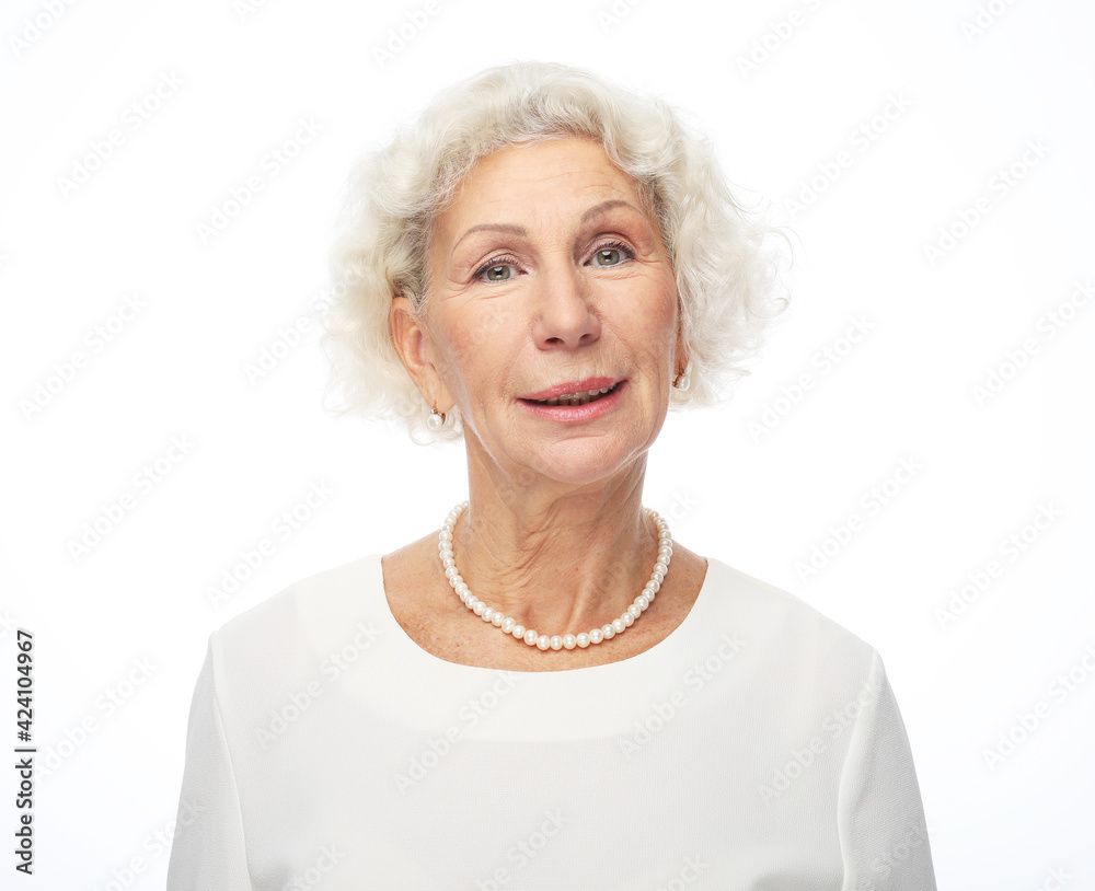 Happy senior woman isolated over white background