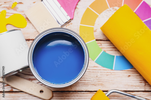 Cans of paints and tools on...