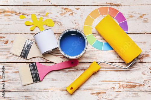 Cans of paints and tools on...