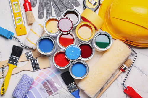 Cans of paints and tools on...