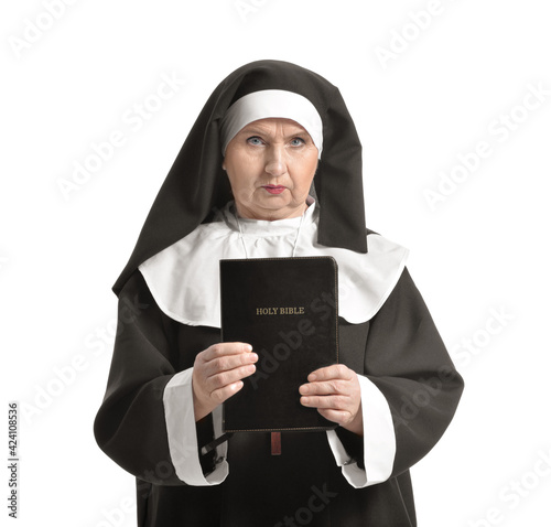 Senior nun with Bible on wh...