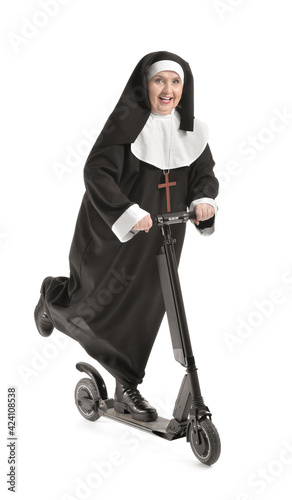 Senior nun with scooter on ...