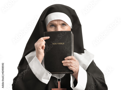 Senior nun with Bible on wh...