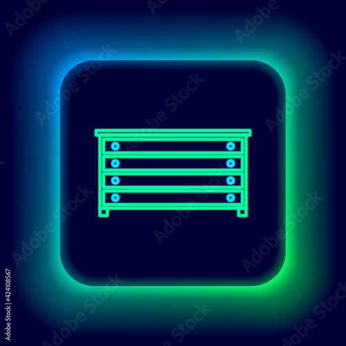 Glowing neon line Chest of drawers icon isolated on black background. Colorful outline concept. Vector