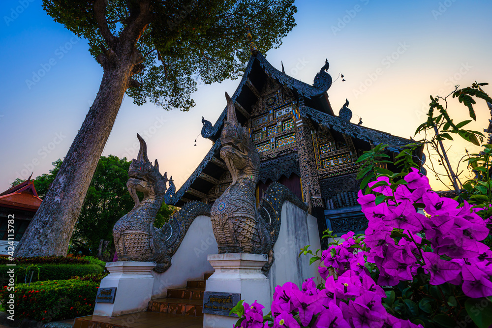 Fototapeta premium Wat Chedi Luang is a Buddhist temple in the historic centre and is a Buddhist temple is a major tourist attraction in Chiang Mai,Thailand.at twilight time blue sky clouds sunset background.