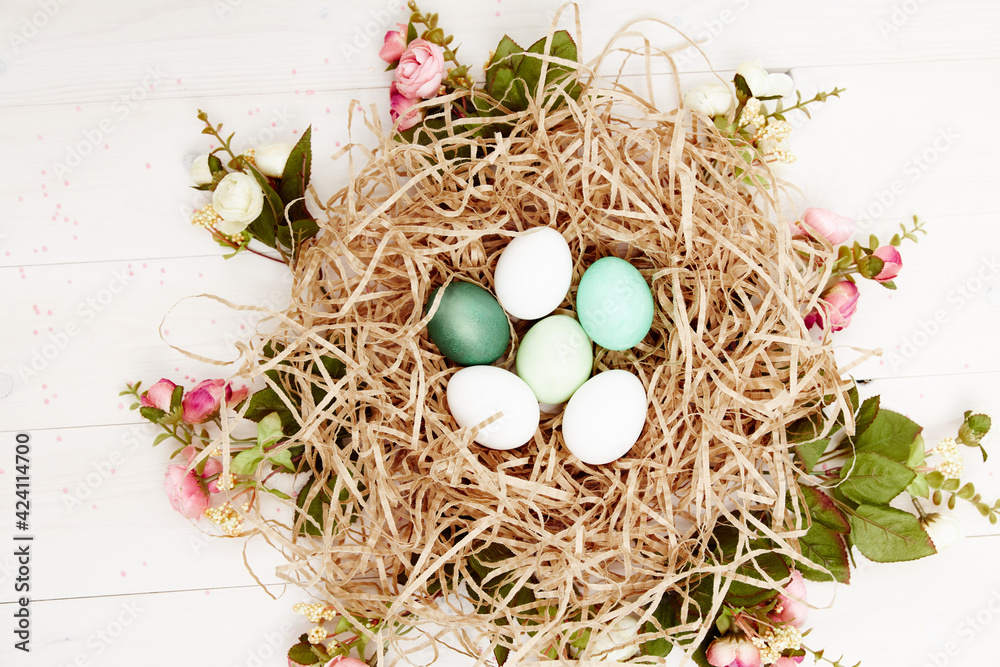 easter eggs in a basket in the form of a nest top view decoration holiday