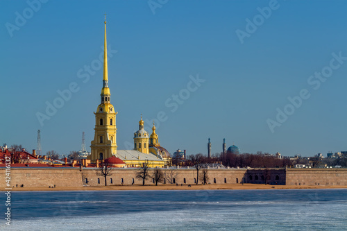 Spring sunny day on the Neva river in the Russia. Peter and Paul Fortress on Hare Island. The Saint Petersburg Mosque in the distance.