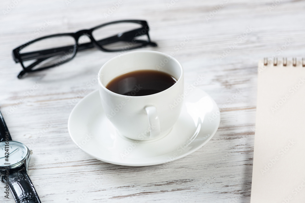 Top view office desk with white cup of coffee Top view office desk with white cup of coffee