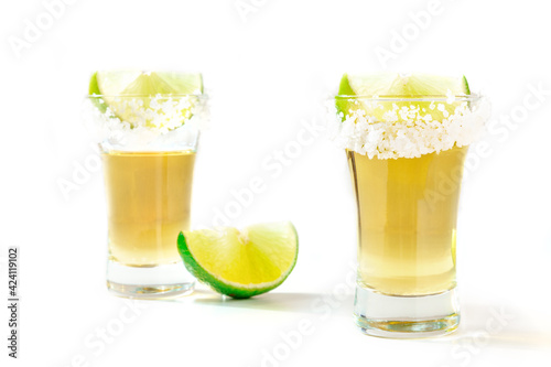 Tequila shots with salted rims and lime slices