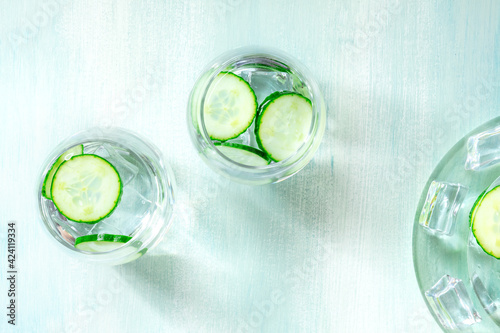 Detox cucumber drink with ice, shot from the top