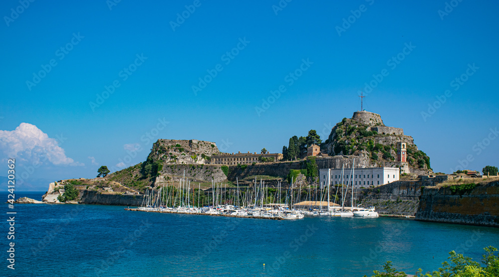 Naklejka premium Summer panoramic seascape. View of the old fortress of Corfu with yachts. The Ionian Archipelago. Greece