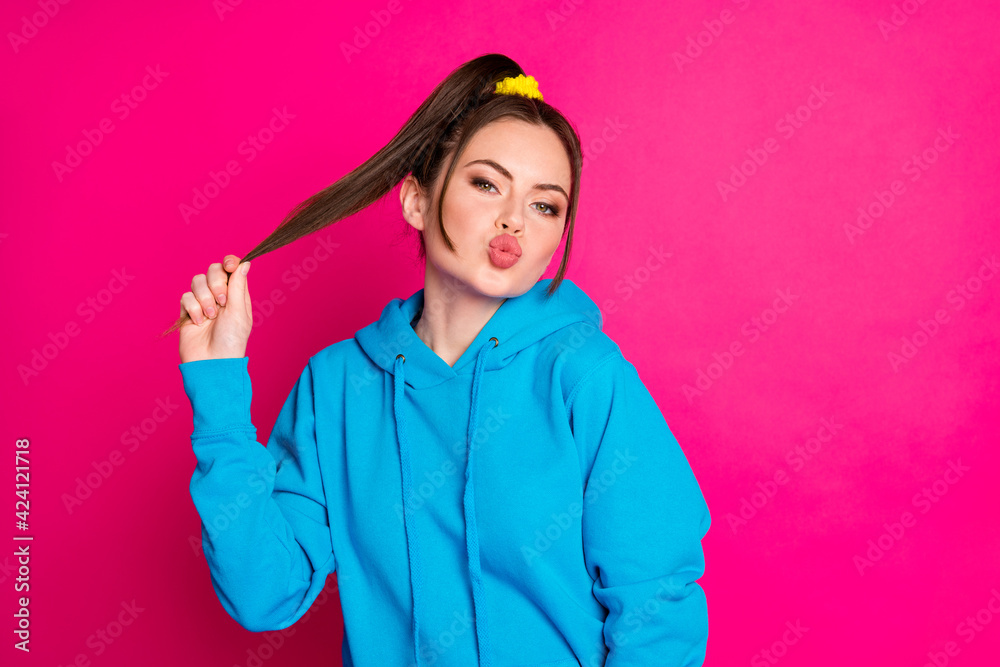 Photo of young beautiful charming gorgeous girl pout lips hold tail perfect hair treatment isolated on pink color background Photo of young beautiful charming gorgeous girl pout lips hold tail perfect hair treatment isolated on pink color background