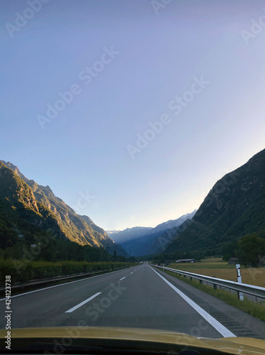 Road trip, view from the car to the mountains. Lugano, Switzerland