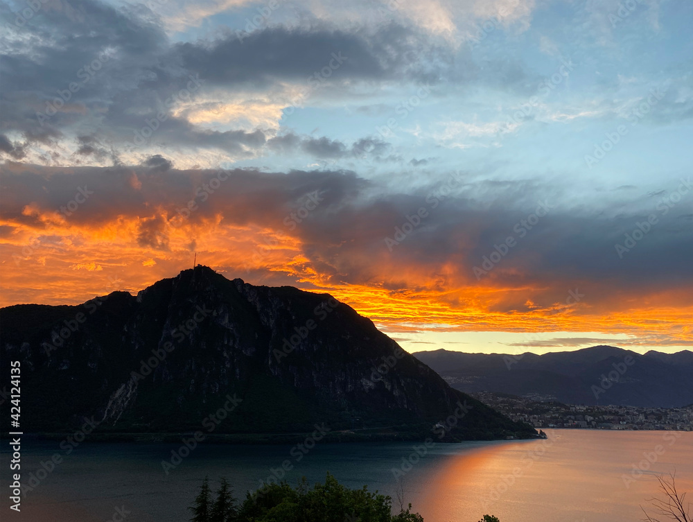 Sunset on the background of mountains. Lugano, Switzerland