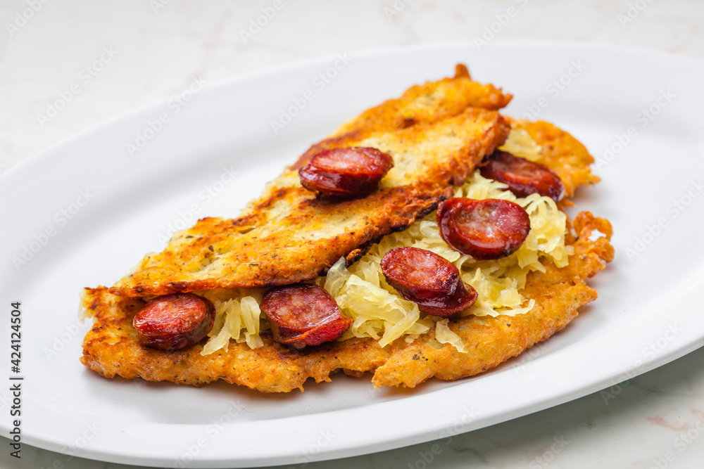 potato pancake filled with cabbage and sausage
