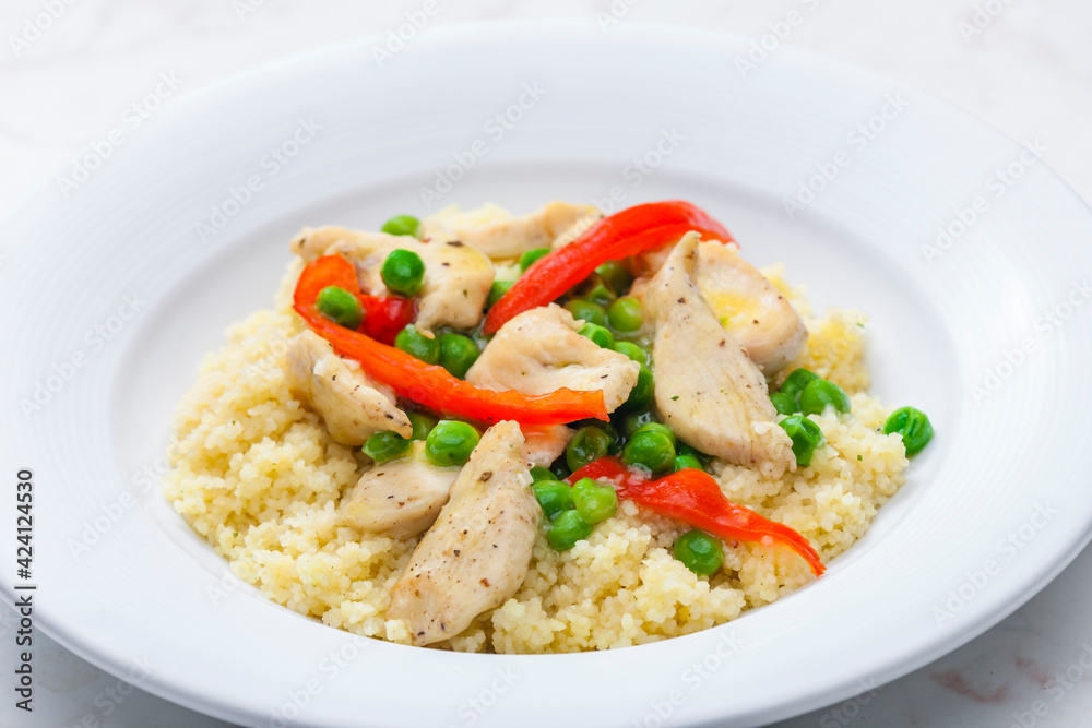 poultry meat with green peas, red pepper and couscous poultry meat with green peas, red pepper and couscous