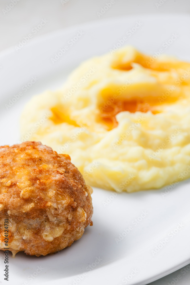 meat ball with cheese served with mashed potatoes meat ball with cheese served with mashed potatoes