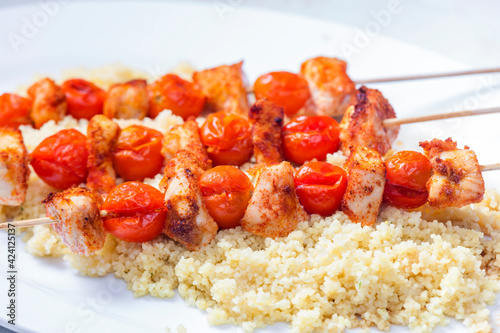 chcicken meat and tomato skewers with couscous photo