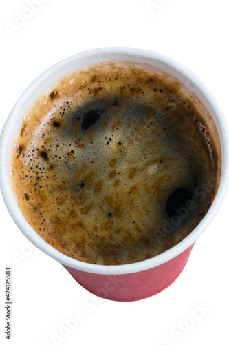 Coffee to go in a paper red glass without a lid isolate on a white background close-up top view © queen1987