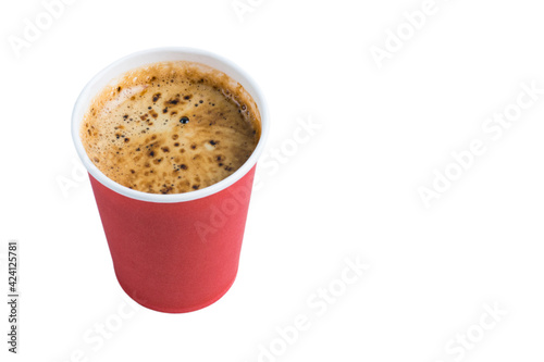 Coffee to go in a paper red glass without a lid isolate on a white background close-up view from the top, copy space from the right