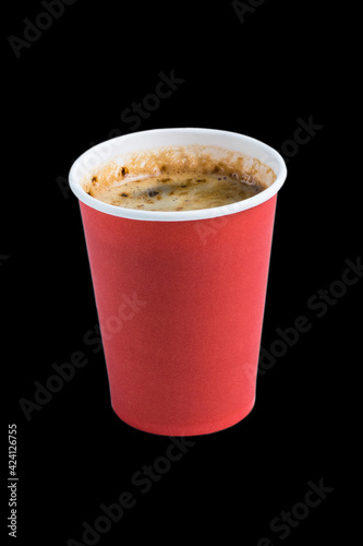 Coffee to go in a paper cup without a lid on a black background copy space top and side view