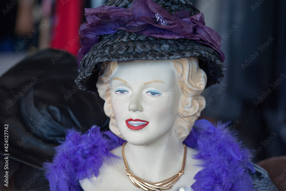 Vintage hats for lady on a mannequin head.