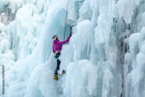 Ice climb with ice-axe and rope