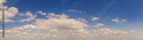 Fototapeta Naklejka Na Ścianę i Meble -  Wide sky panorama with scattered cumulus clouds