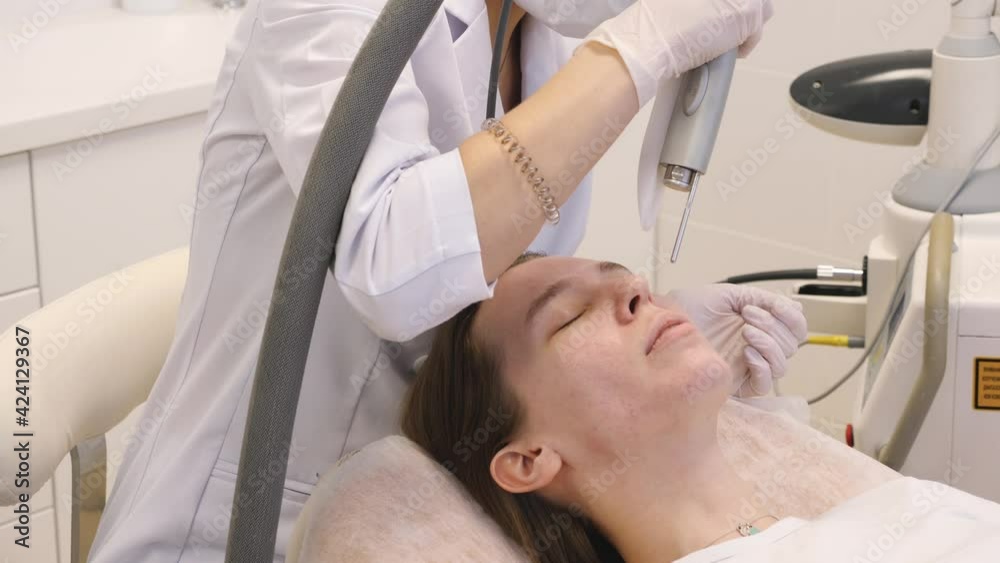The procedure of rejuvenation of the female face with a laser. Beauty treatments The procedure of rejuvenation of the female face with a laser. Beauty treatments