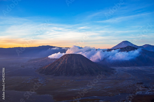 Terrific Bromo Tengger Semeru National Park on East Java  Indonesia. Aerial view of erupting volcano Bromo  Mount Semeru and Mount Batok from Penanjakan view point  observation area to see sunrise.