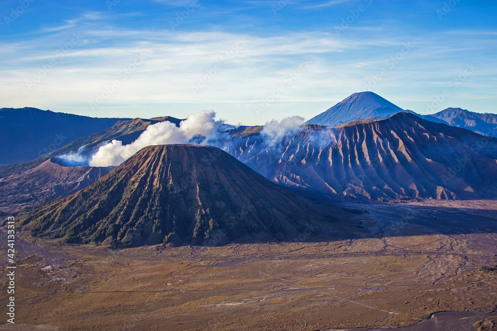 Beautiful sunny morning at Bromo Tengger Semeru National Park on East Java, Indonesia. Aerial view of volcano Bromo, Mount Semeru and Mount Batok from Penanjakan view point