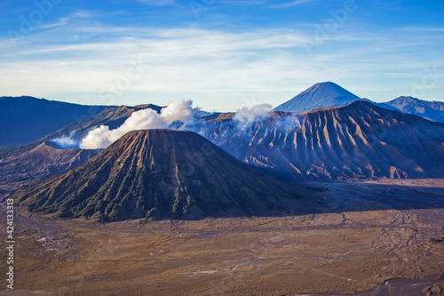 Beautiful sunny morning at Bromo Tengger Semeru National Park on East Java, Indonesia. Aerial view of volcano Bromo, Mount Semeru and Mount Batok from Penanjakan view point