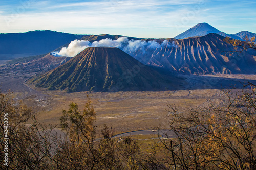 Beautiful early morning at Bromo Tengger Semeru National Park on East Java, Indonesia. Aerial view of volcano Bromo, Mount Semeru and Mount Batok from Penanjakan view point
