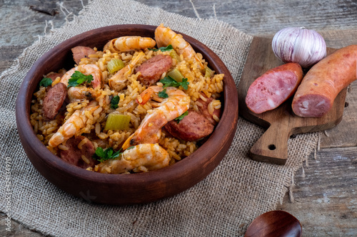 A classic dish of Cajun cuisine is jambalaya with shrimps and sausages. photo