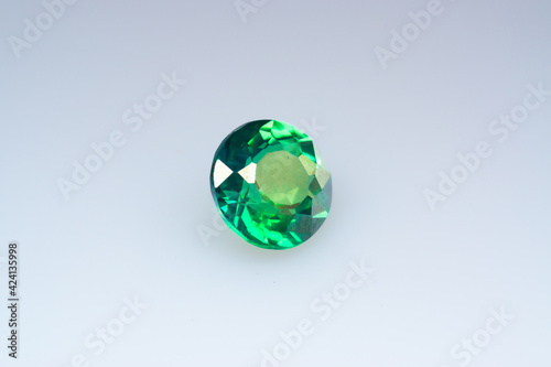 Natural gemstone green sapphire on white background
