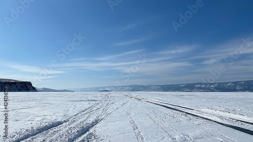 Frozen snow-capped Lake Baikal. Mountains, hills and endless expanses of Russia. © chekart