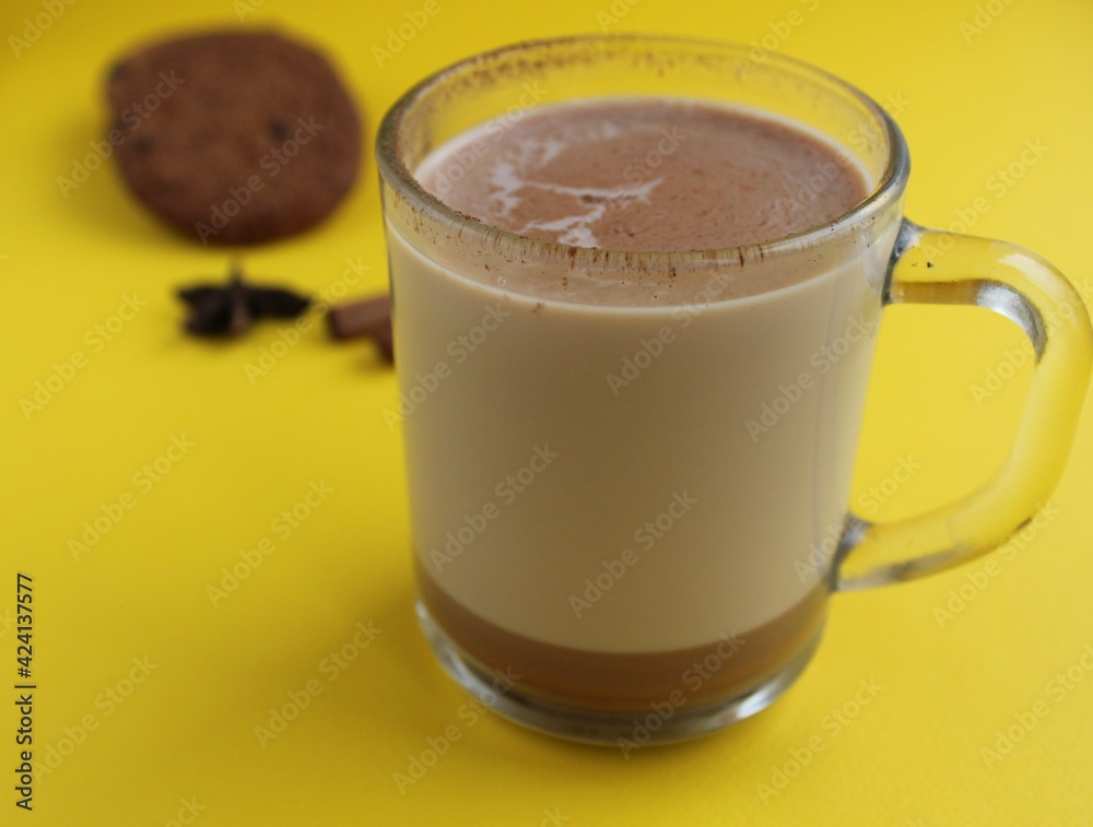 a cup of hot chocolate cocoa on a bright yellow background with room for a copyspace text a cup of hot chocolate cocoa on a bright yellow background with room for a copyspace text