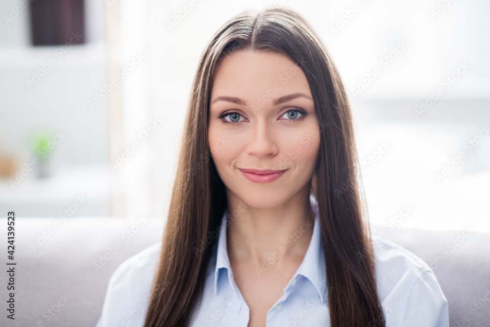 Photo of nice optimistic brunette lady wear blue shirt alone at home Photo of nice optimistic brunette lady wear blue shirt alone at home