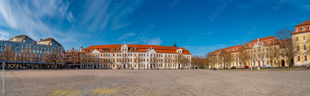 Panoramic view over major square with fountains in Magdeburg by Cathedral and Government Office, at sunny day and blue sky.
