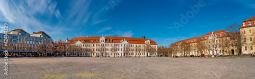 Panoramic view over major square with fountains in Magdeburg by Cathedral and Government Office, at sunny day and blue sky.