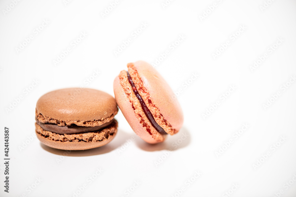 several multi-colored macaroon cakes on a white background several multi-colored macaroon cakes on a white background