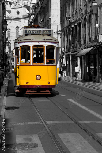 Famous tram number 28 in Lisbon. Travel picture developed in post-production to isolate the yellow of the tram.