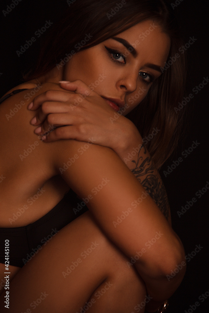 portrait of young woman with big eyes which is sitting like baby. lifestyle concept, free space portrait of young woman with big eyes which is sitting like baby. lifestyle concept, free space