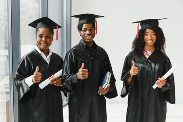optimistic young university graduates at graduation
