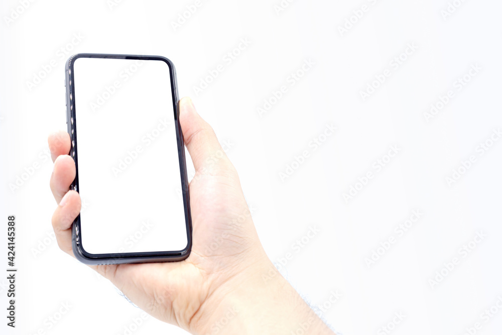 Holding the right hand the smartphone black color with white screen ,isolated on white background Holding the right hand the smartphone black color with white screen ,isolated on white background