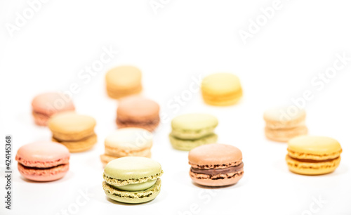 several multi-colored macaroon cakes on a white background