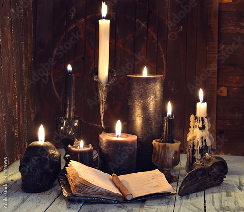 Fotografie, Obraz Still life with burning candles and open diary book on witch table